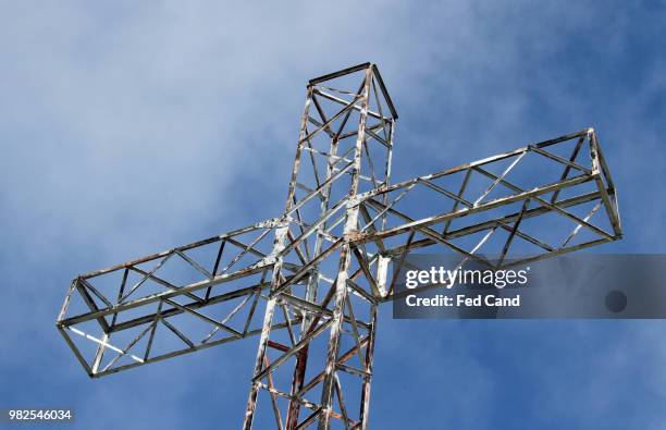 cross of iron over the top of the mountain - iron cross stock pictures, royalty-free photos & images