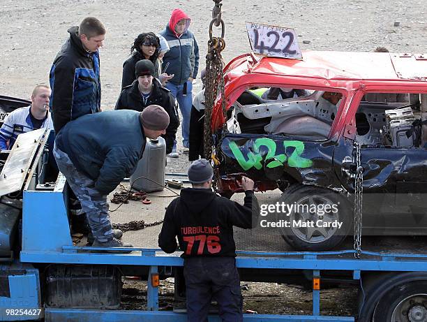 Banger racing team try to get a car ready for another heat at the United Downs Raceway banger racing meet in St Day near Redruth on April 4, 2010 in...