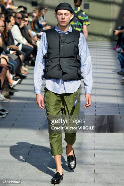 Model walks the runway during the Junya Watanabe Man Menswear Spring/Summer 2019 fashion show as part of Paris Fashion Week on June 22, 2018 in...