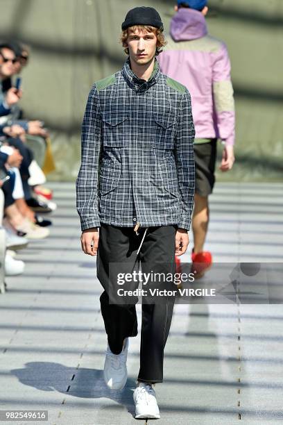 Model walks the runway during the Junya Watanabe Man Menswear Spring/Summer 2019 fashion show as part of Paris Fashion Week on June 22, 2018 in...