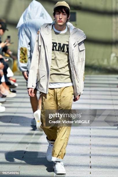 Model walks the runway during the Junya Watanabe Man Menswear Spring/Summer 2019 fashion show as part of Paris Fashion Week on June 22, 2018 in...