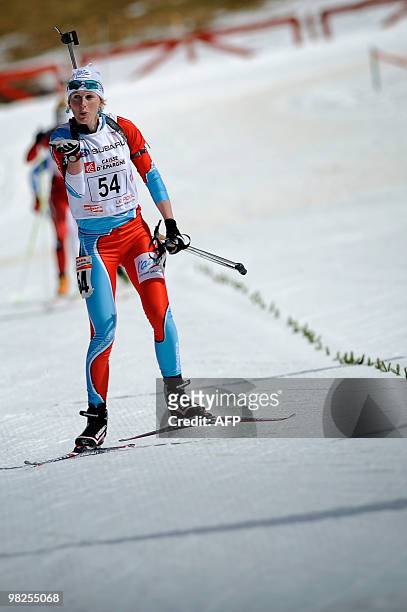 French Sandrine Bailly, who won a silver medal in the 2010 Vancouver Olympics, reacts as she finished her race, on April 5, 2010 in Premanon, eastern...