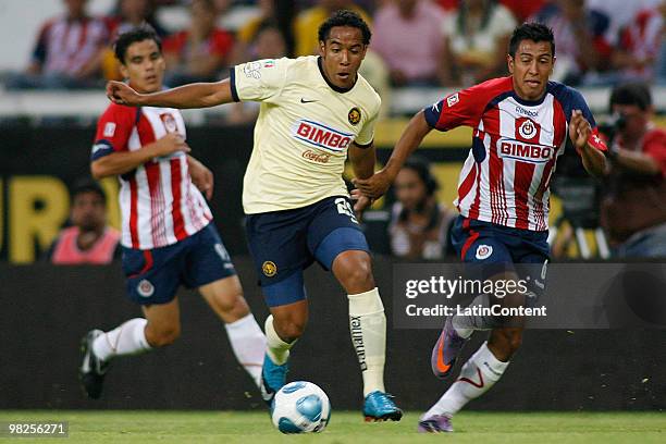 America's player Jean Beausejour vies for the ball with Omar Esparza of Chivas Guadalajara during their match as part of the 2010 Bicentenary...