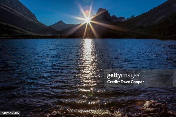 sunset over swift current lake - swift current lake stock pictures, royalty-free photos & images