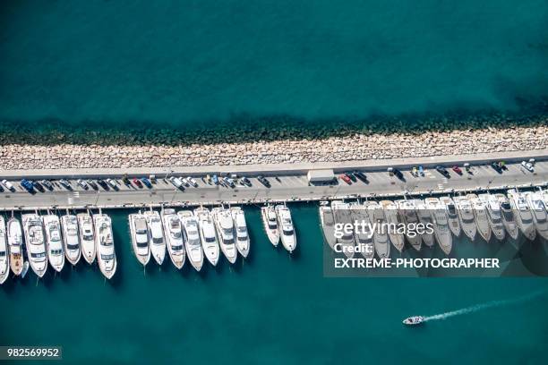 yachts on a pier - marina stock pictures, royalty-free photos & images