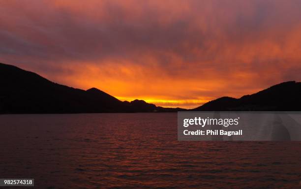 fiery sunset over fuschlsee austria - fuschlsee stockfoto's en -beelden