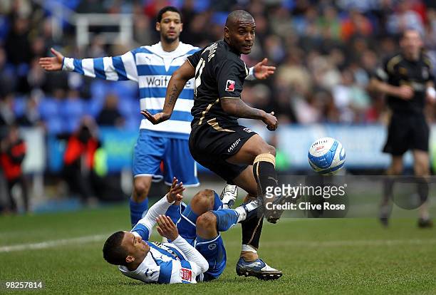 Clinton Morrison of Coventry City is challenged by Ryan Bertrand of Reading during the Coca Cola Championship game between Reading and Coventry City...