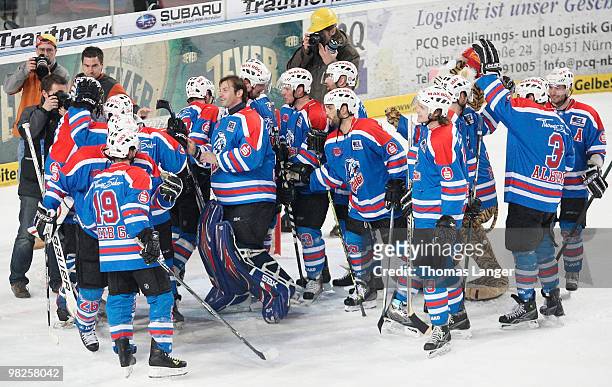 Players of Nuremberg celebrate after winning the fourth DEL quarter final play-off game between Thomas Sabo Ice Tigers Nuremberg and Hannover...