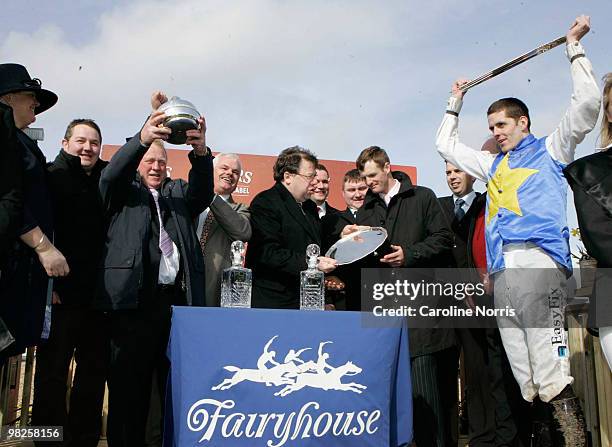 Taoiseach Brian Cowen presents winning Trainer James Motherway with a trophy after Andrew McNamara and Bluesea Cracker won the Powers Whiskey Irish...