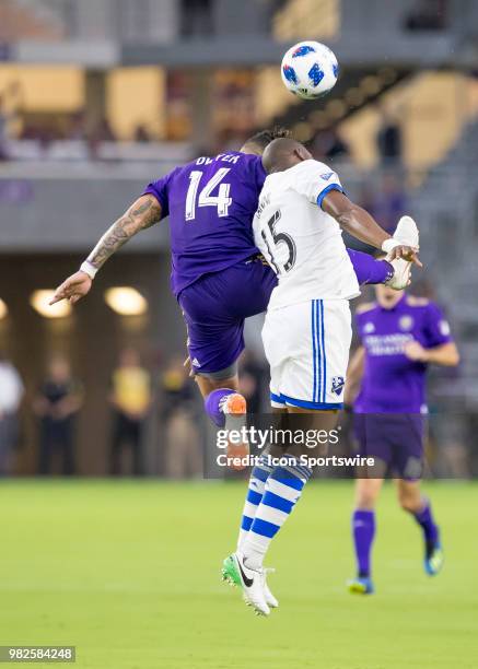 Orlando City forward Dom Dwyer and Montreal Impact defender Rod Fanni challenge for a header During the MLS soccer match between the Orlando City SC...