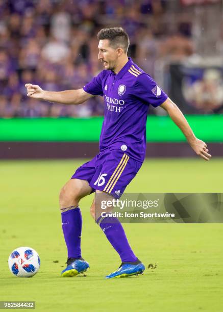 Orlando City midfielder Sacha Kljestan passes the ball During the MLS soccer match between the Orlando City SC and Montreal Impact on June 23rd, 2018...