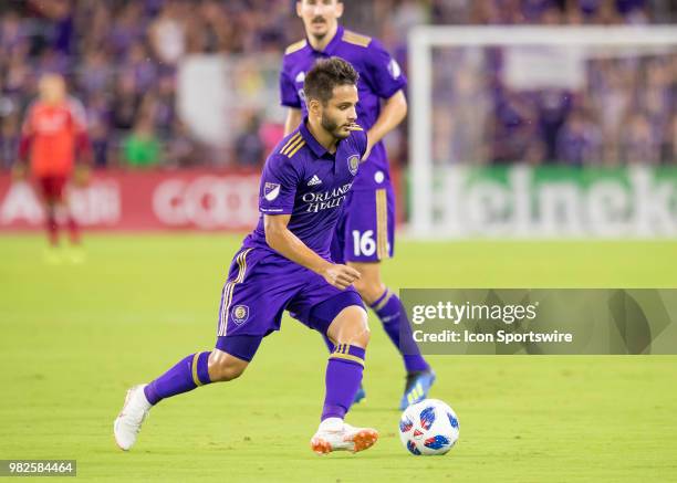 Orlando City midfielder Josue Colman dribbles the ball During the MLS soccer match between the Orlando City SC and Montreal Impact on June 23rd, 2018...