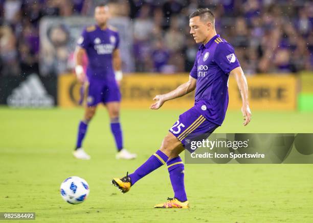 Orlando City defender Donny Toia passes the ball During the MLS soccer match between the Orlando City SC and Montreal Impact on June 23rd, 2018 at...