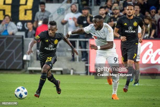 Harrison Afful of Columbus Crew handles the ball defended by Adama Diomande of the LAFC in the Los Angeles FC MLS game at Banc of California Stadium...