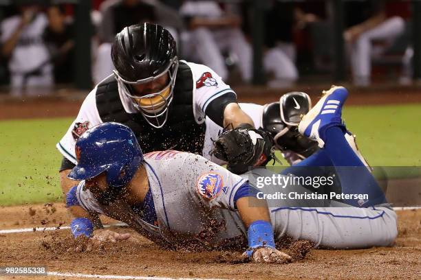 Jose Bautista of the New York Mets is tagged out by catcher Alex Avila of the Arizona Diamondbacks attempting to score a run during the second inning...