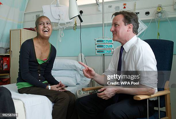 Conservative Party leader David Cameron talks 19 year old cancer sufferer Gurpeet Bharya in the Teenage Cancer trust unit at University college...