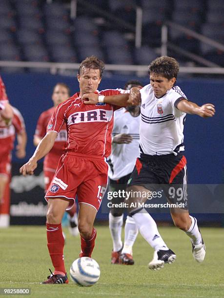 Chicago Fire midfielder Jesse Marsch battles D. C. United forward Jaime Moreno for the ball June 29, 2005 in Chicago. The Fire won 4 to 3.