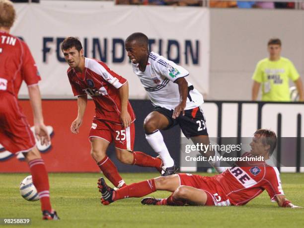Chicago Fire midfielder Logan Pause and Gonzalo Segares battle D. C. United forward Jamil Walker for the ball June 29, 2005 in Chicago. The Fire won...