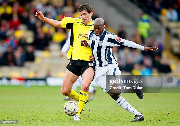 Danny Graham of Watford and Youssouf Mulumbu of West Bromwich Albion battle for the ball during the Coca Cola Championship match between Watford and...