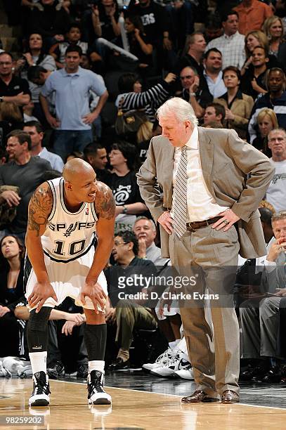 Keith Bogans of the San Antonio Spurs listens to head coach Gregg Popovich during the game against the Cleveland Cavaliers on March 26, 2010 at the...