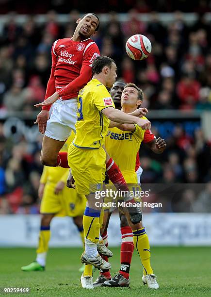 Darcy Blake and Stephen McPhail of Cardiff City battle with Dexter Blackstock of Nottingham Forest during the Coca Cola Championship match between...