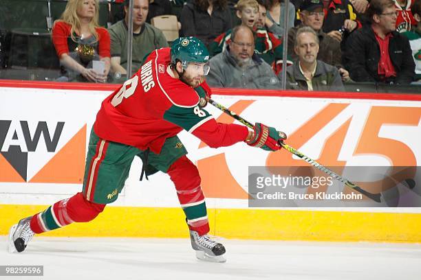 Brent Burns of the Minnesota Wild takes a shot against the Chicago Blackhawks during the game at the Xcel Energy Center on March 31, 2010 in Saint...