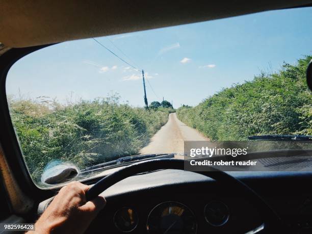 driver view inside car of country road - classic car point of view stock pictures, royalty-free photos & images