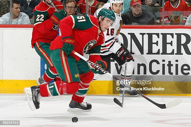 James Sheppard of the Minnesota Wild skates with the puck against the Chicago Blackhawks during the game at the Xcel Energy Center on March 31, 2010...