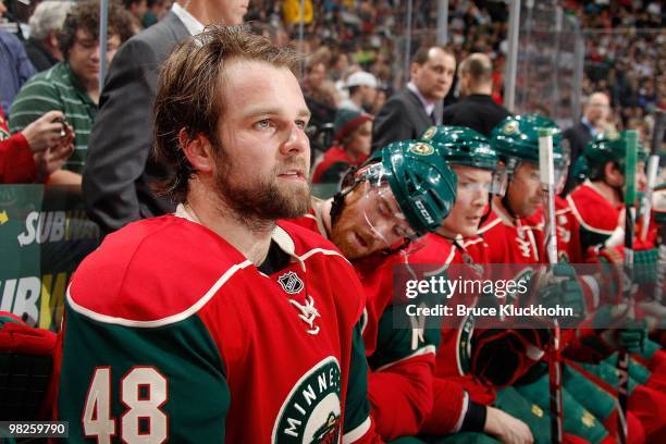Guillaume Latendresse of the Minnesota Wild watches the action from the bench against the Chicago Blackhawks during the game at the Xcel Energy...