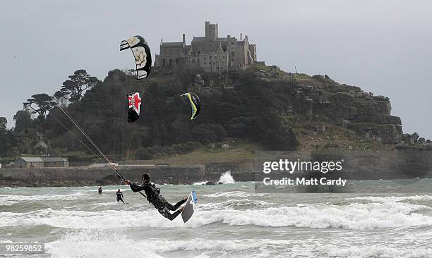 Kite surfers enjoy the windy weather in Mount's Bay near St Michael's Mount near Penzance on April 5, 2010 in Cornwall, United Kingdom. Many people...