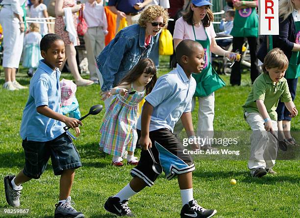 Children participate during the annual White House Easter Egg Roll at the South Lawn April 5, 2010 in Washington, DC. The White House Easter Egg Roll...