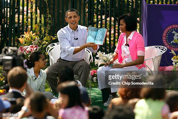 President Barack Obama reads "Green Eggs and Ham," by Dr. Suess, for a group of children and his family, first lady Michelle Obama and daughters...