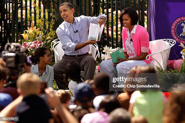 President Barack Obama reads "Green Eggs and Ham," by Dr. Suess, for a group of children and his family, first lady Michelle Obama and daughters...