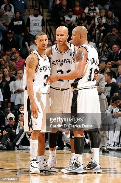 George Hill, Richard Jefferson and Keith Bogans of the San Antonio Spurs huddle on the court during the game against the Cleveland Cavaliers on March...
