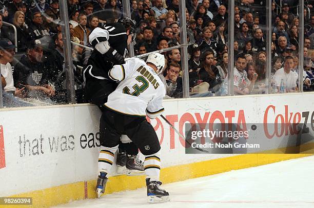 Stephane Robidas of the Dallas Stars throws a check against Anze Kopitar of the Los Angeles Kings on March 27, 2010 at Staples Center in Los Angeles,...