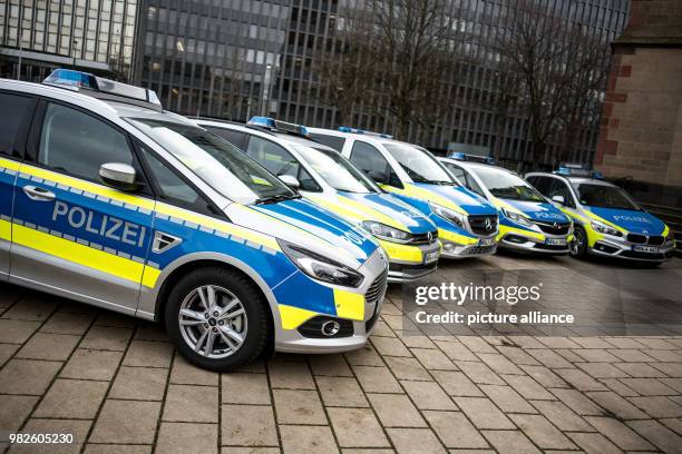 Police patrol cars of the types Ford S-Max , VW Touran, Mercedes-Benz Vito, Opel Zafira and BMW 2er parked during a press conference by the North...