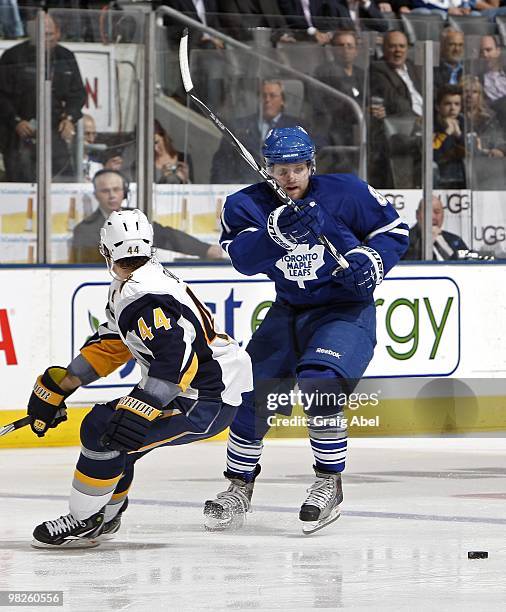 Phil Kessel of the Toronto Maple Leafs avoids the check of Andrej Sekera of the Buffalo Sabres during the game on April 1, 2010 at the Air Canada...