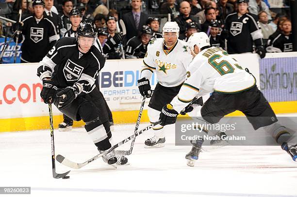 Fredrik Modin of the Los Angeles Kings skates with the puck against Mike Ribeiro of the Dallas Stars on March 27, 2010 at Staples Center in Los...