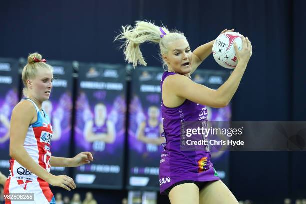 Gretel Tippett of the Firebirds catches during the round eight Super Netball match between the Firebirds and the Swifts at Brisbane Entertainment...