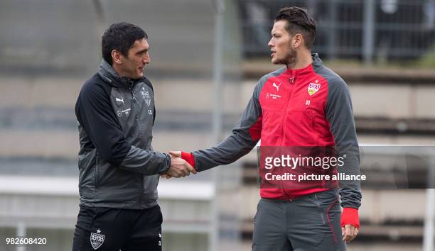 Tayfun Korkut , coach of the German Bundesliga soccer team VfB Stuttgart, greeting team player Daniel Ginczek during the first training of his team...