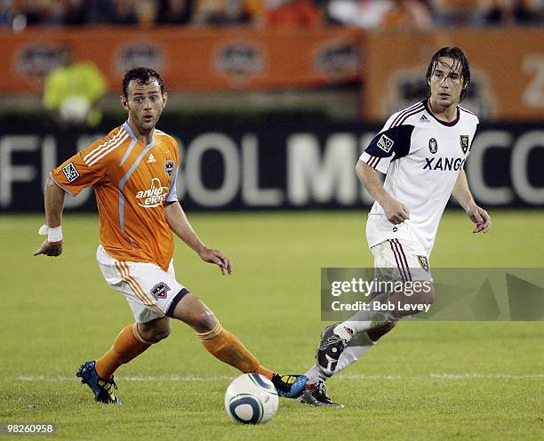 Brad Davis of the Houston Dynamo handles the ball as he gets a little pressure from Ned Grabavoy of Real Salt Lake at Robertson Stadium on April 1,...