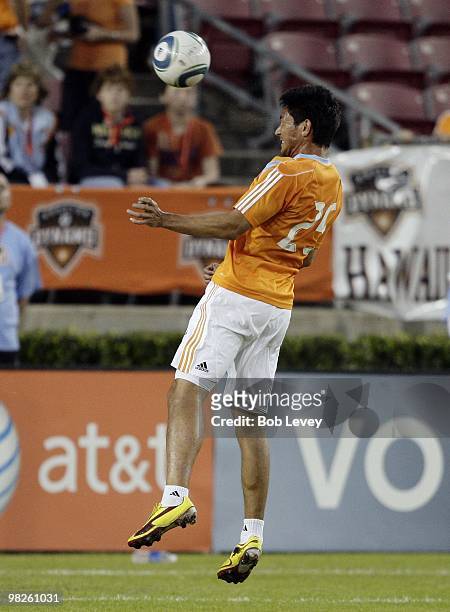 Brian Ching of the Houston Dynamo heads the ball away on April 1, 2010 in Houston, Texas.