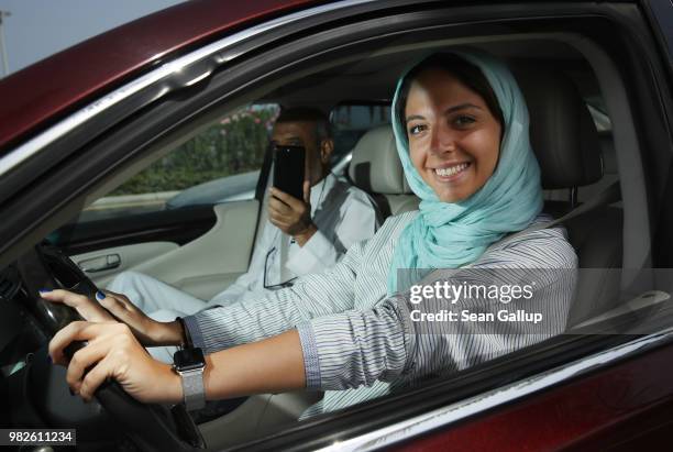 Young woman drives a car on the first day she is legally allowed to drive in Saudi Arabia on June 24, 2018 in Jeddah, Saudi Arabia. Saudi Arabia has...