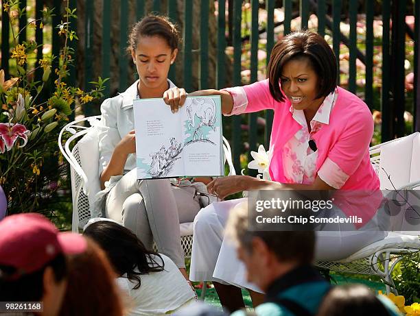 First lady Michelle Obama reads "Horton Hears A Who!," by Dr. Suess, for a group of children and her daughter Malia Obama during the Easter Egg Roll...