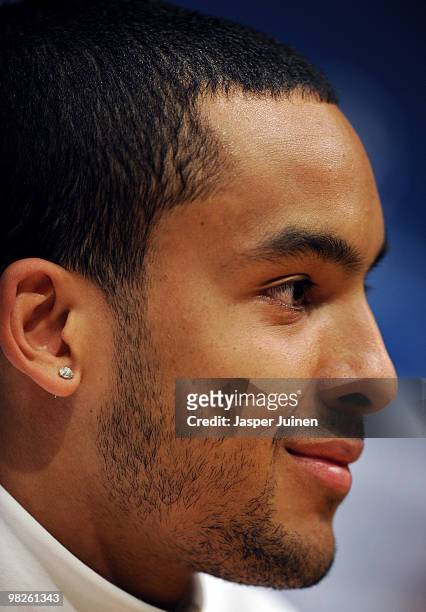 Theo Walcott of Arsenal listens to questions during a press conference ahead of their UEFA Champions League quarter final second leg match against...