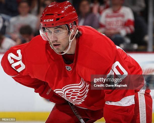 Drew Miller of the Detroit Red Wings gets set for the face-off during an NHL game against the Columbus Blue Jackets at Joe Louis Arena on April 1,...