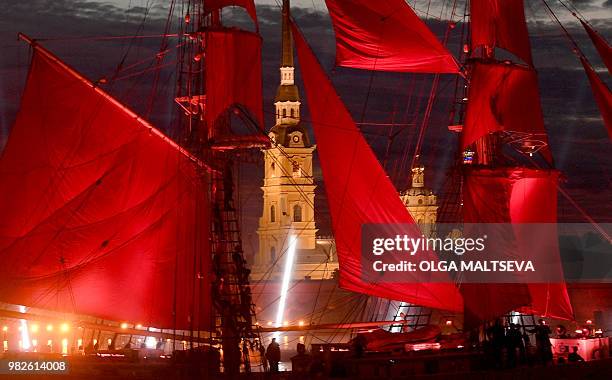Vintage ship with scarlet sails passes on the Neva River in central Saint Petersburg, late on June 23 during the "Scarlet Sails," a romantic holiday...