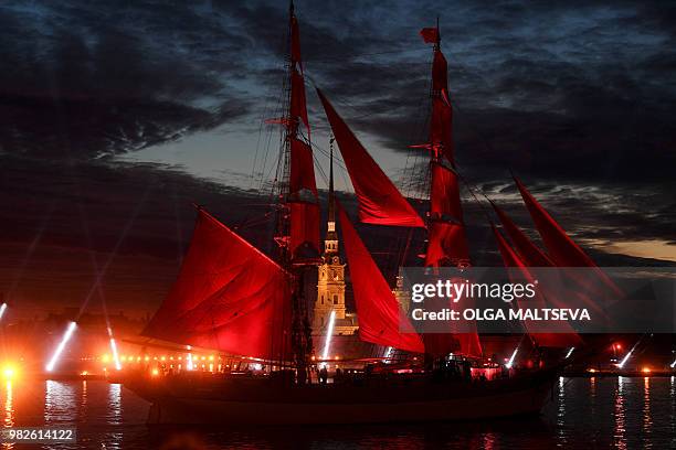 Vintage ship with scarlet sails passes on the Neva River in central Saint Petersburg, late on June 23 during the "Scarlet Sails," a romantic holiday...