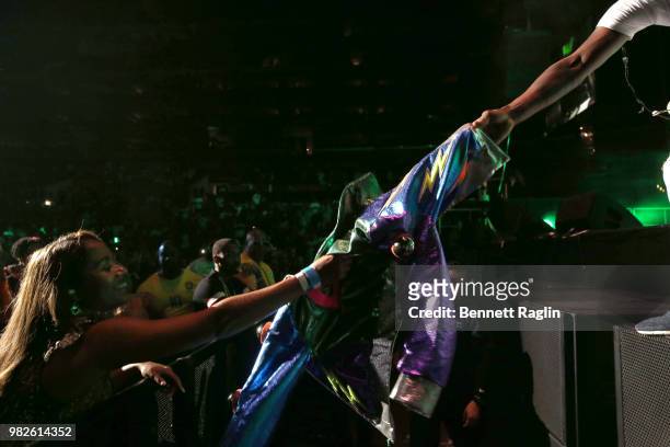 Fan receives Slim Jxmmi's jacket and glasses at the STAPLES Center Concert Sponsored by SPRITE during the 2018 BET Experience on June 23, 2018 in Los...