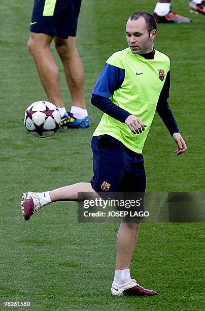 Barcelona's player midfielder Andres Iniesta takes part in a training session on the eve of his team's UEFA Champions League football match against...